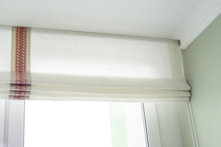 White Roman shades